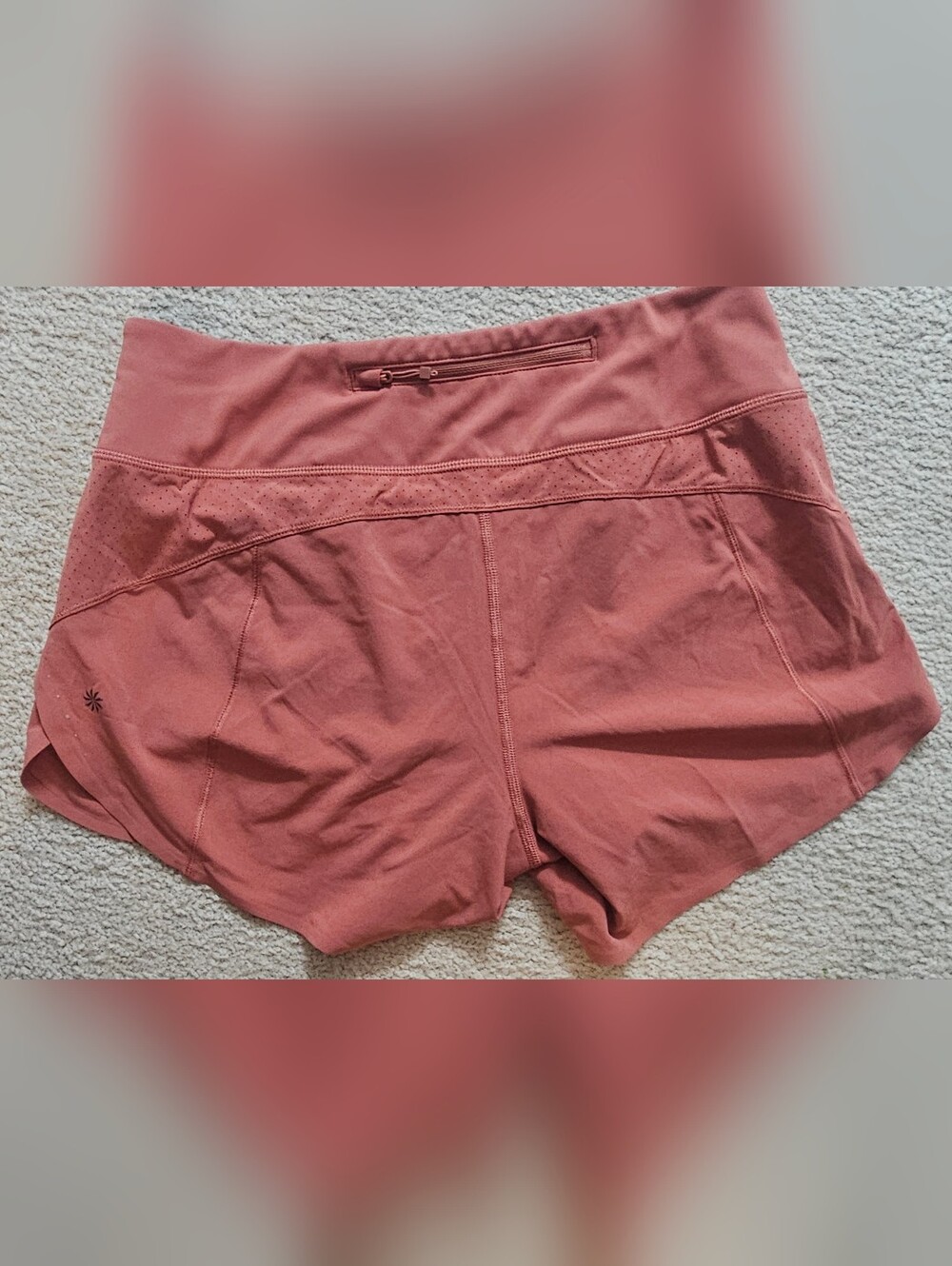 Athleta running shorts coral color feature a wide waistband and a side tag. Smal - Picture 3 of 8